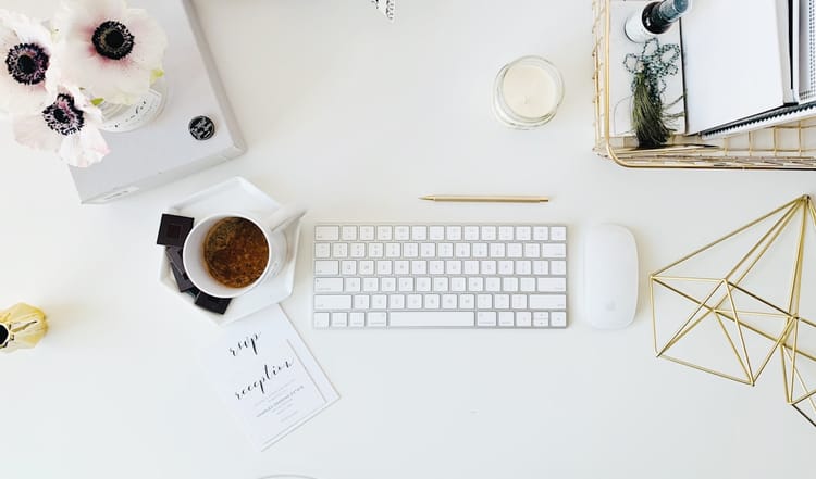mature woman writing desk professional